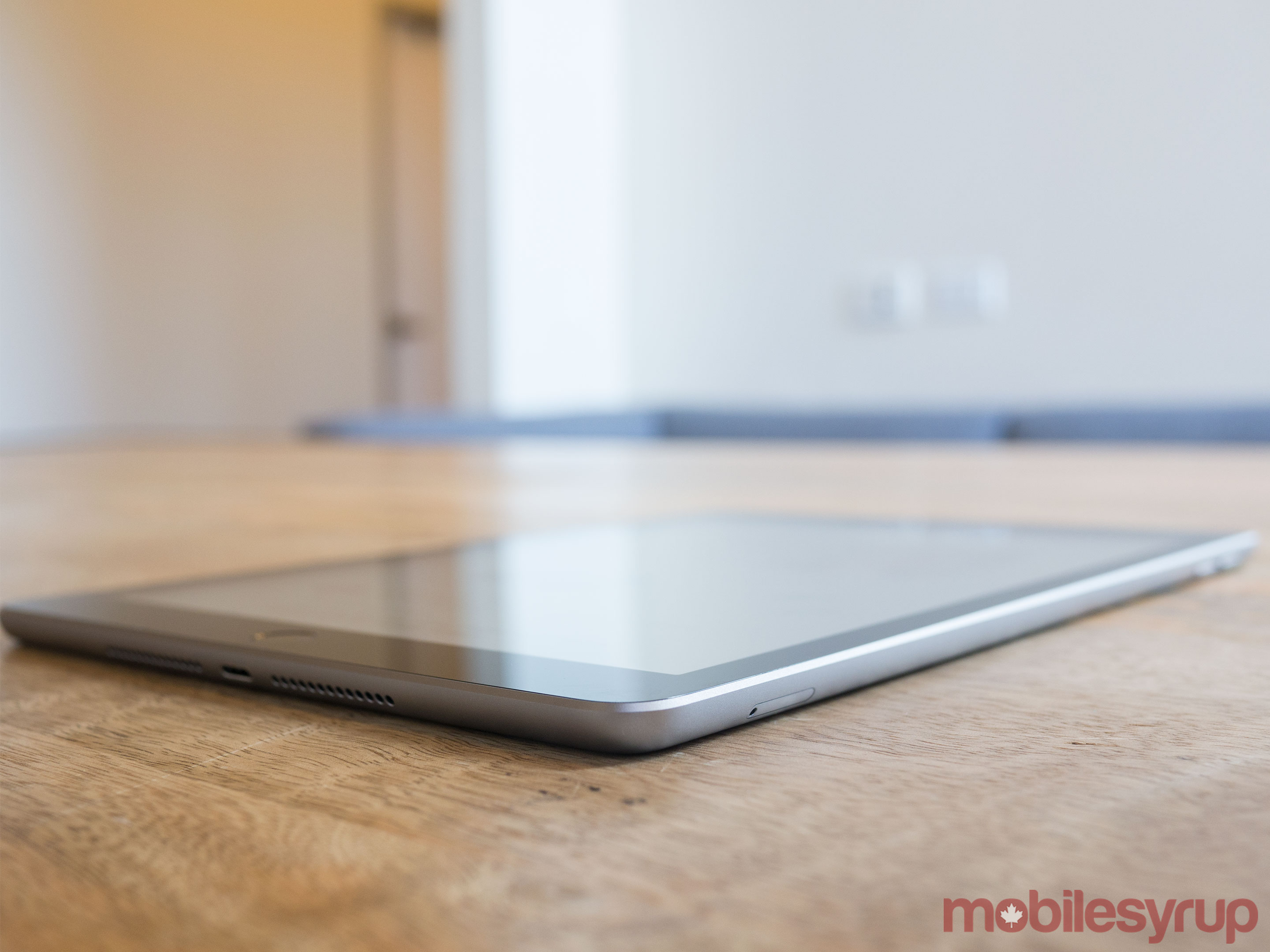 9.7-inch iPad side view on table 