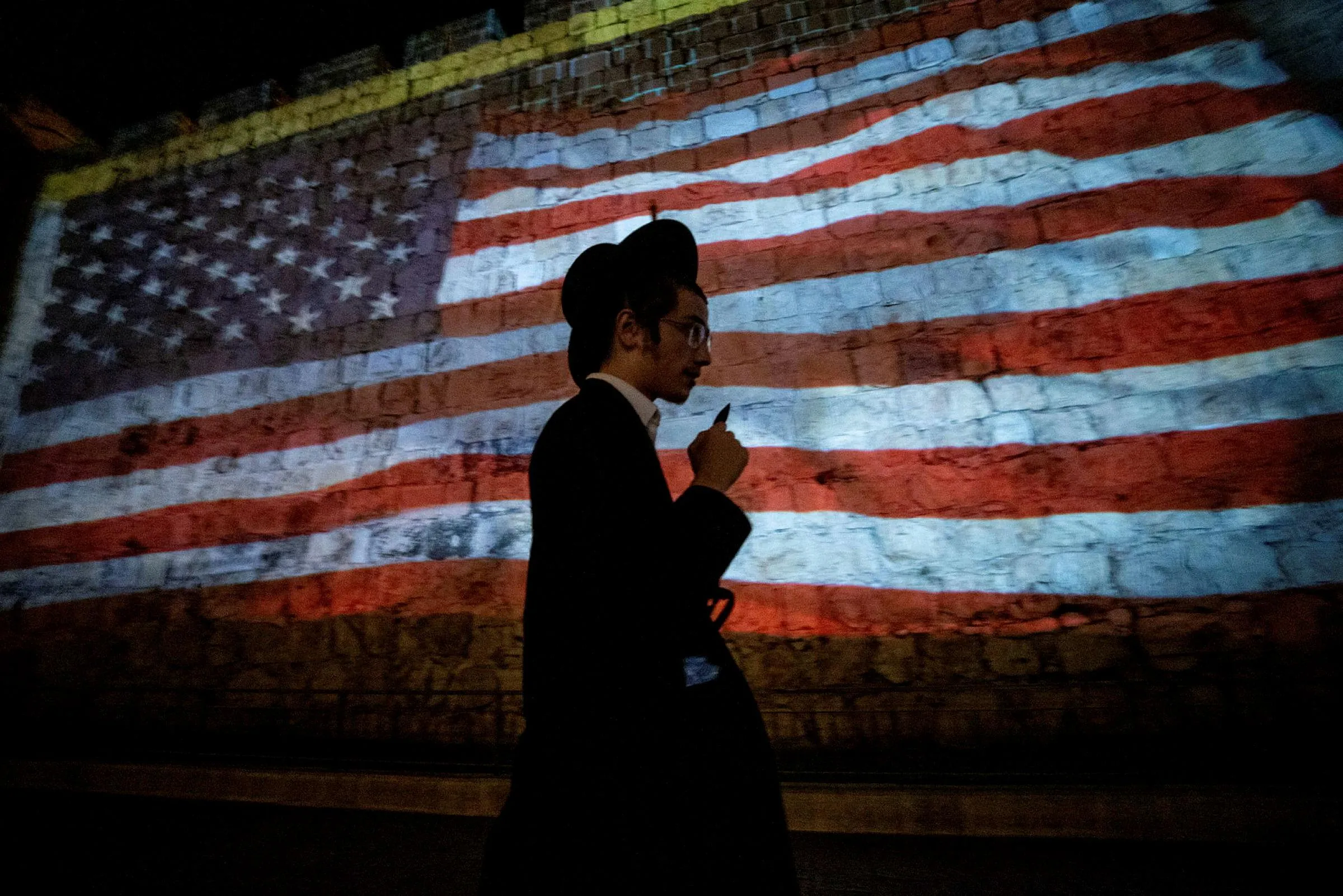 An American flag projected onto the walls of Jerusalem's Old City. The era of bipartisan, almost unconditional U.S. support for Israel is coming to an end. Credit: Ohad Zweigenberg An American flag projected onto the walls of Jerusalem's Old City. The era of bipartisan, almost unconditional U.S. support for Israel is coming to an end.